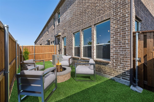 3144 Galveston St, Plano, TX 75075 - rear view of property with brick siding and a fire pit