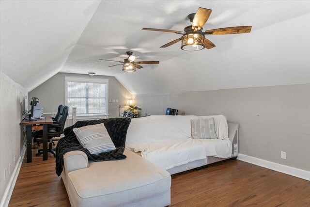 bedroom with a ceiling fan, baseboards, vaulted ceiling, and wood finished floors