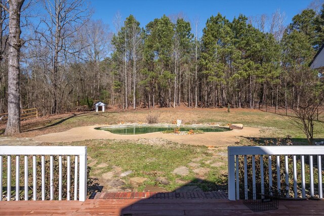 view of yard featuring an outdoor pool