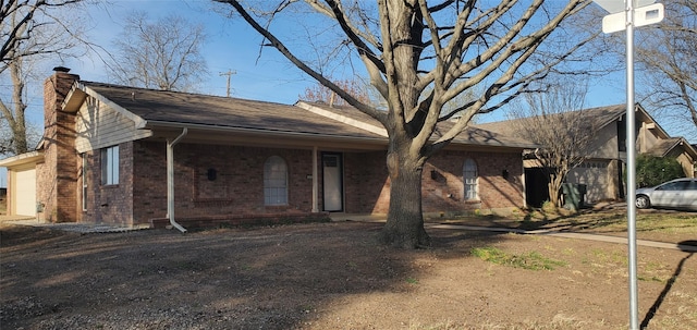 425 Oxford Dr, Sherman, TX 75092 - ranch-style home featuring brick siding and a chimney