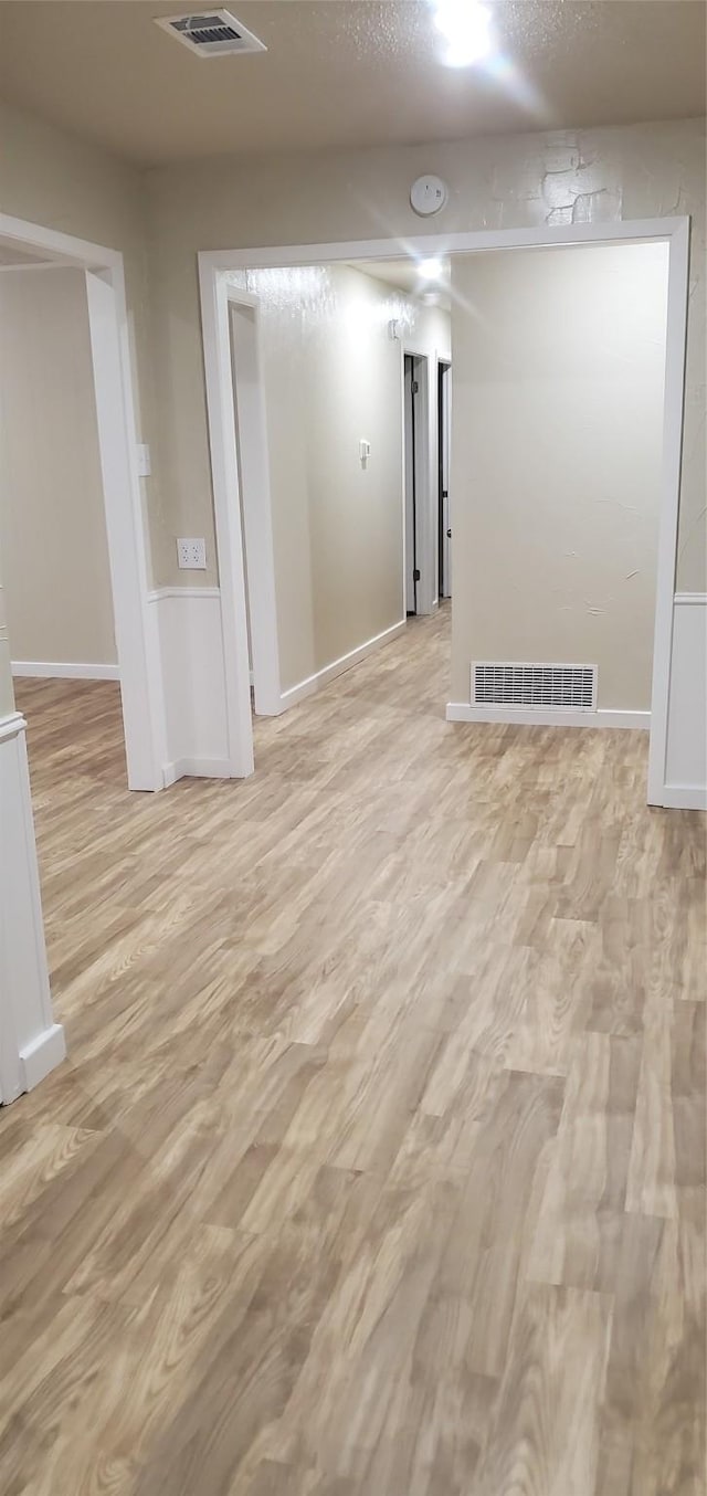 425 Oxford Dr, Sherman, TX 75092 - unfurnished room featuring a textured ceiling, visible vents, and light wood finished floors