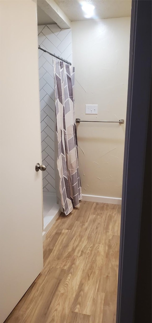 425 Oxford Dr, Sherman, TX 75092 - bathroom featuring a shower stall and wood finished floors