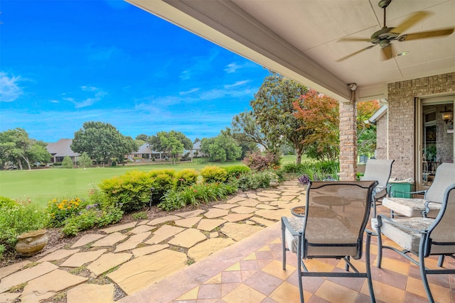 view of patio featuring ceiling fan and outdoor dining space