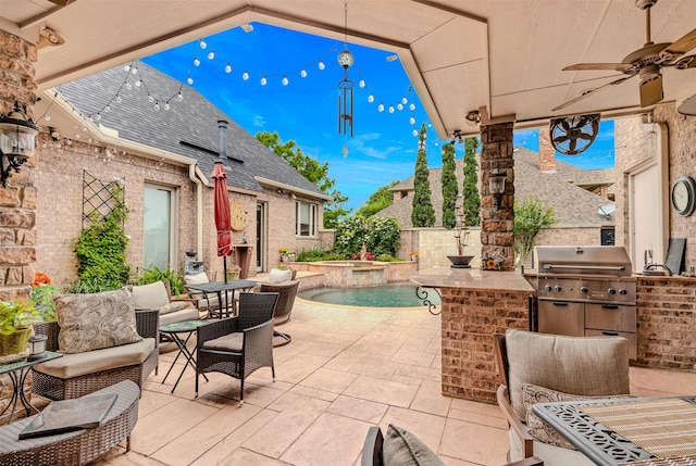 view of patio with an in ground hot tub, an outdoor kitchen, an outdoor hangout area, grilling area, and ceiling fan