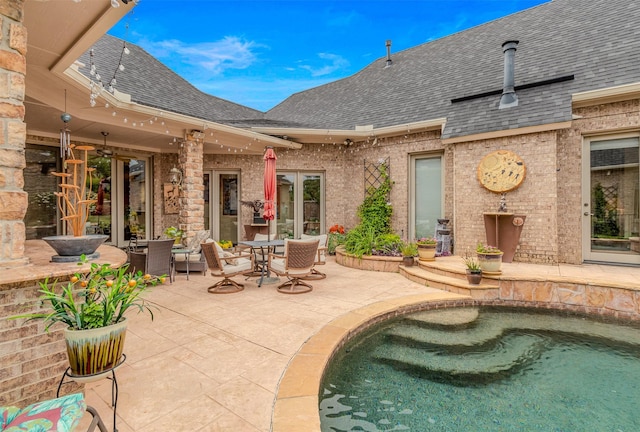 view of pool featuring a patio