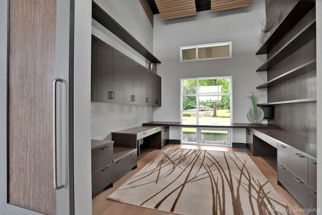 613 Moore Rd, Elm Grove, LA 71051 - mudroom with built in desk, light wood finished floors, and a towering ceiling