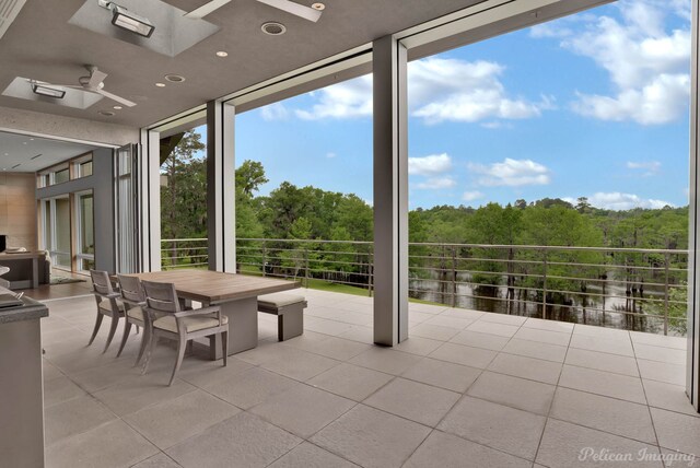 613 Moore Rd, Elm Grove, LA 71051 - sunroom / solarium featuring a skylight and a forest view