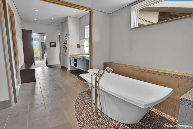 613 Moore Rd, Elm Grove, LA 71051 - full bathroom featuring a freestanding bath, vanity, recessed lighting, and tile patterned floors
