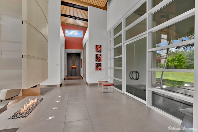 613 Moore Rd, Elm Grove, LA 71051 - interior space with a high ceiling, tile patterned flooring, and baseboards