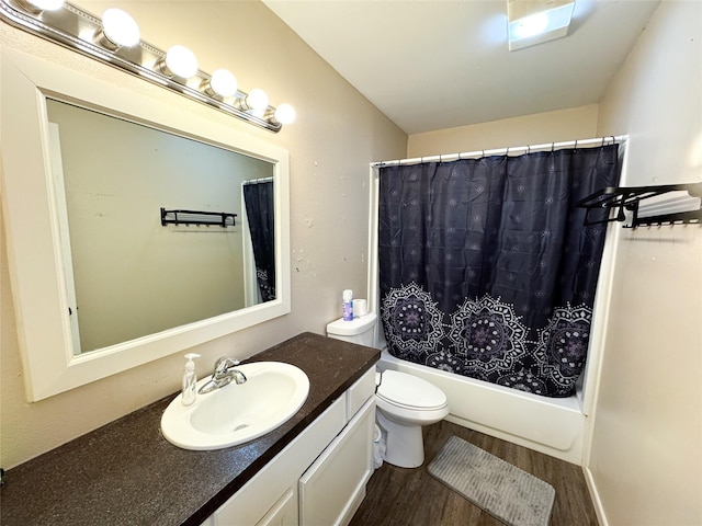 311 S Fir Ave, Munday, TX 76371 - bathroom with toilet, wood finished floors, vanity, and shower / bath combo