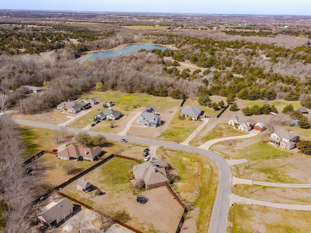 drone / aerial view featuring a residential view and a water view