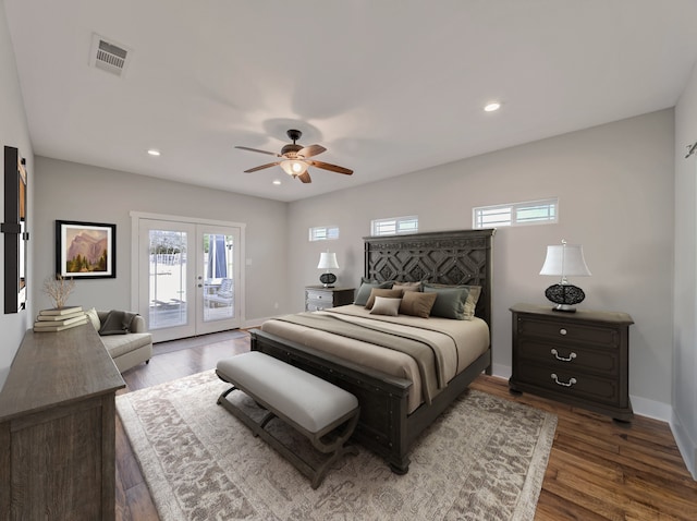 bedroom with access to exterior, french doors, wood finished floors, baseboards, and recessed lighting