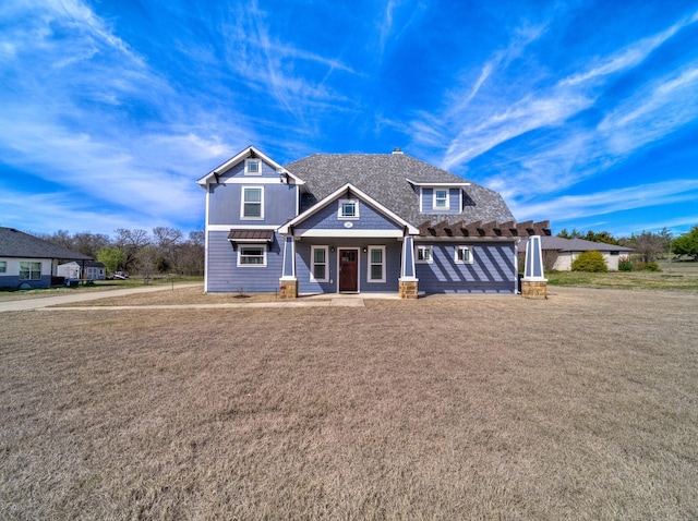 craftsman house featuring a front lawn, metal roof, and a standing seam roof
