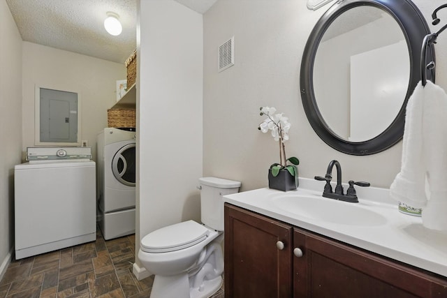 2700 Stonehaven Ct, Irving, TX 75038 - half bathroom featuring visible vents, vanity, and toilet