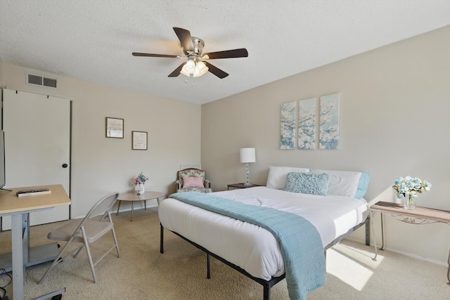 2700 Stonehaven Ct, Irving, TX 75038 - bedroom featuring a textured ceiling, a ceiling fan, and light colored carpet