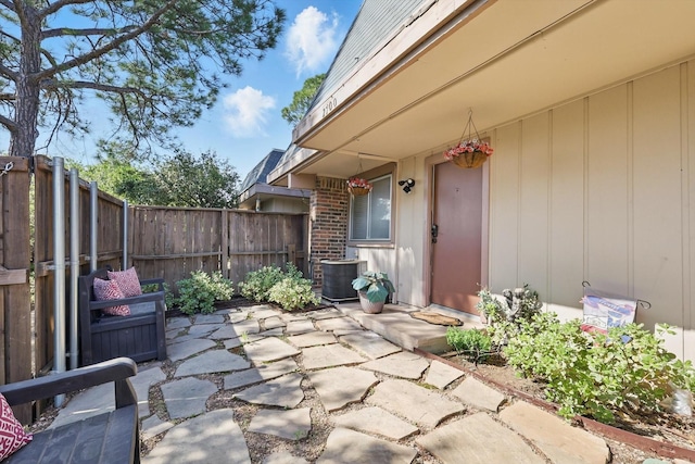 2700 Stonehaven Ct, Irving, TX 75038 - doorway to property with fence, central AC, and a patio