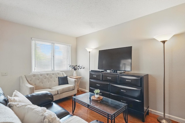 2700 Stonehaven Ct, Irving, TX 75038 - living area featuring a textured ceiling, wood finished floors, visible vents, and baseboards