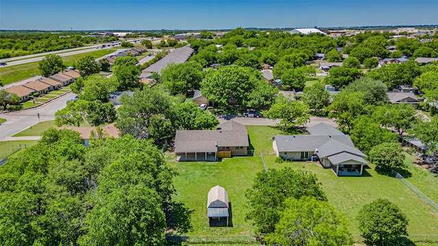 birds eye view of property with a residential view