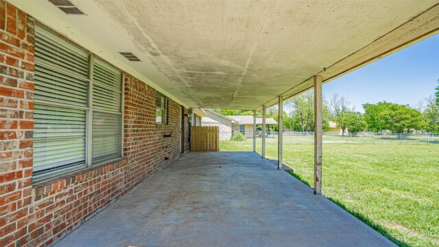 view of patio with fence and visible vents