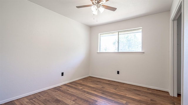 unfurnished bedroom featuring dark wood-type flooring, ceiling fan, and baseboards