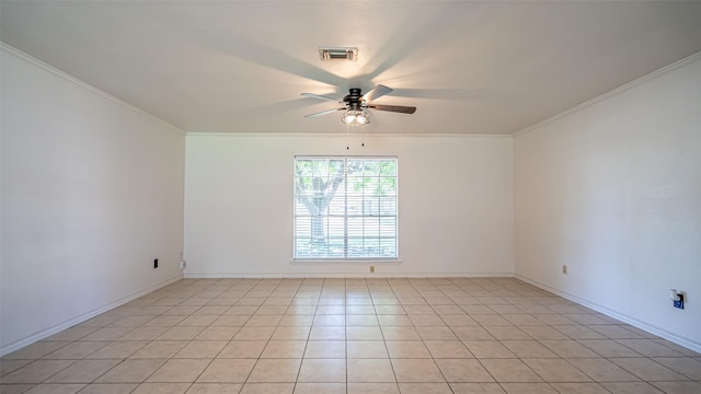 unfurnished room featuring light tile patterned flooring, a ceiling fan, visible vents, baseboards, and ornamental molding