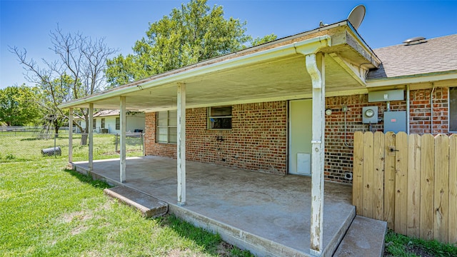 view of patio featuring fence