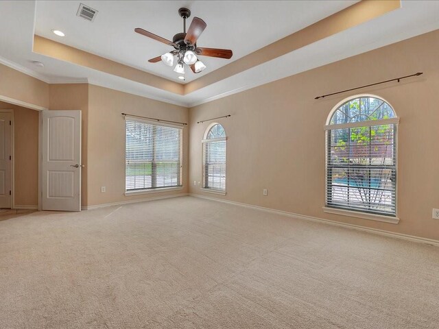 1904 Loblolly Ln, Lufkin, TX 75904 - spare room with a tray ceiling, baseboards, ceiling fan, light colored carpet, and recessed lighting