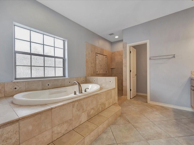1904 Loblolly Ln, Lufkin, TX 75904 - full bath featuring a bath, baseboards, and a tile shower