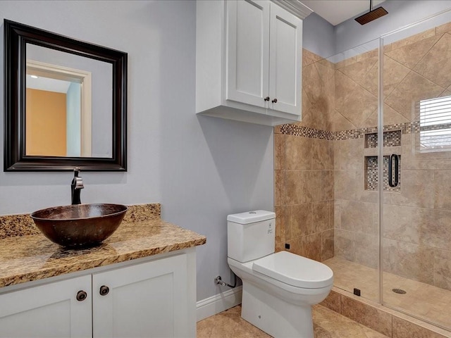1904 Loblolly Ln, Lufkin, TX 75904 - bathroom with a shower stall, baseboards, vanity, and toilet
