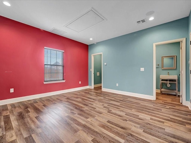 1904 Loblolly Ln, Lufkin, TX 75904 - empty room with attic access, wood finished floors, recessed lighting, and baseboards