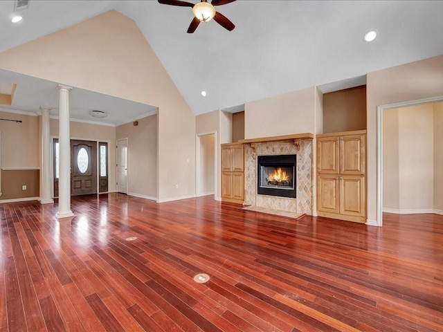 1904 Loblolly Ln, Lufkin, TX 75904 - unfurnished living room with decorative columns, ceiling fan, wood finished floors, high vaulted ceiling, and crown molding