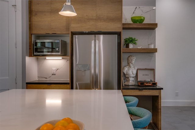 2239 Lovedale Ave Unit 105, Dallas, TX 75235 - kitchen with open shelves, appliances with stainless steel finishes, baseboards, and brown cabinets