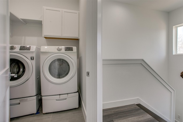 2239 Lovedale Ave Unit 105, Dallas, TX 75235 - clothes washing area with cabinet space and washer and dryer