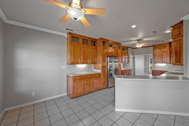4489 E Fm 120, Denison, TX 75021 - kitchen with stainless steel fridge with ice dispenser, ornamental molding, a peninsula, a ceiling fan, and brown cabinets
