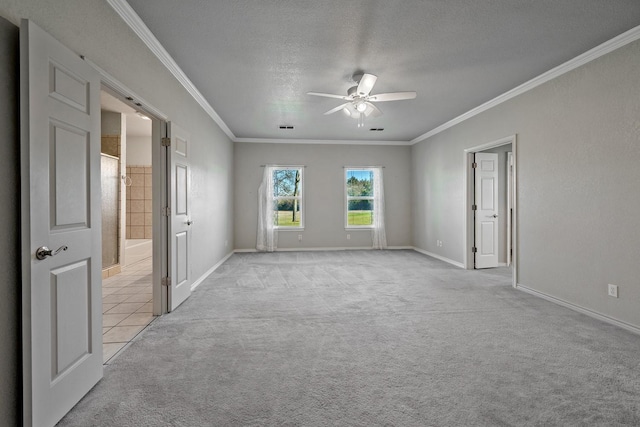4489 E Fm 120, Denison, TX 75021 - spare room featuring crown molding, ceiling fan, a textured ceiling, light carpet, and baseboards
