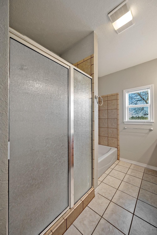 4489 E Fm 120, Denison, TX 75021 - bathroom with baseboards, tile patterned floors, a shower stall, visible vents, and a bath