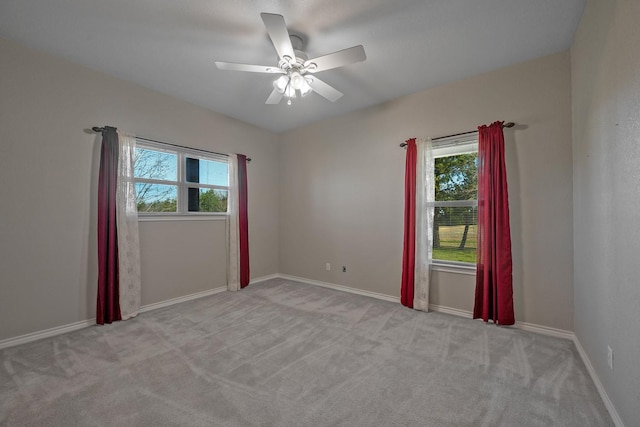 4489 E Fm 120, Denison, TX 75021 - spare room with baseboards, a ceiling fan, and carpet