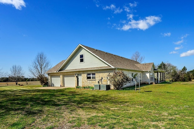 4489 E Fm 120, Denison, TX 75021 - view of property exterior with an attached garage, a yard, and driveway