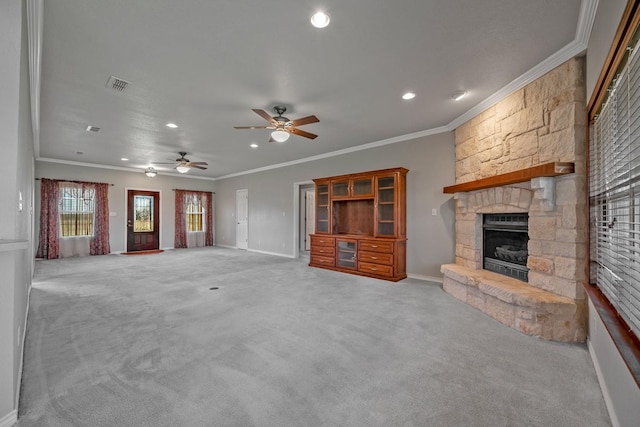 4489 E Fm 120, Denison, TX 75021 - unfurnished living room featuring a stone fireplace, light colored carpet, and ornamental molding