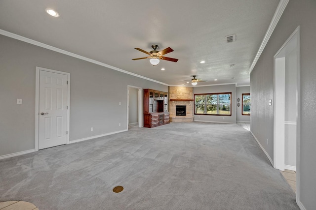 4489 E Fm 120, Denison, TX 75021 - unfurnished living room featuring a ceiling fan, carpet flooring, a large fireplace, and ornamental molding