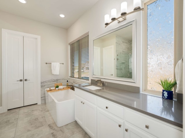 1040 Sugar Bars Dr, Lucas, TX 75002 - full bathroom featuring a freestanding tub, a stall shower, vanity, tile patterned floors, and recessed lighting