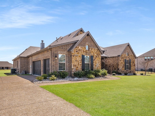 1040 Sugar Bars Dr, Lucas, TX 75002 - view of front of house with asphalt driveway, central AC unit, stone siding, and a front yard