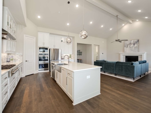 1040 Sugar Bars Dr, Lucas, TX 75002 - kitchen featuring appliances with stainless steel finishes, a sink, open floor plan, light countertops, and beamed ceiling
