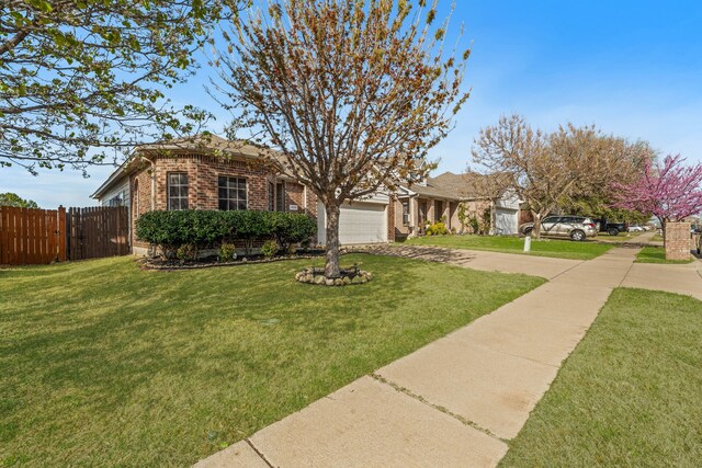 1028 Castle Top Dr, Fort Worth, TX 76052 - view of front facade featuring concrete driveway, a garage, and brick siding