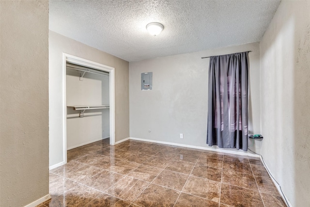 3816 Lauretta Dr, Fort Worth, TX 76119 - unfurnished bedroom with baseboards, a textured wall, and a closet