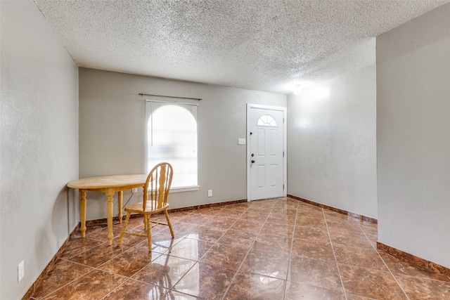 3816 Lauretta Dr, Fort Worth, TX 76119 - entryway with baseboards and a textured ceiling