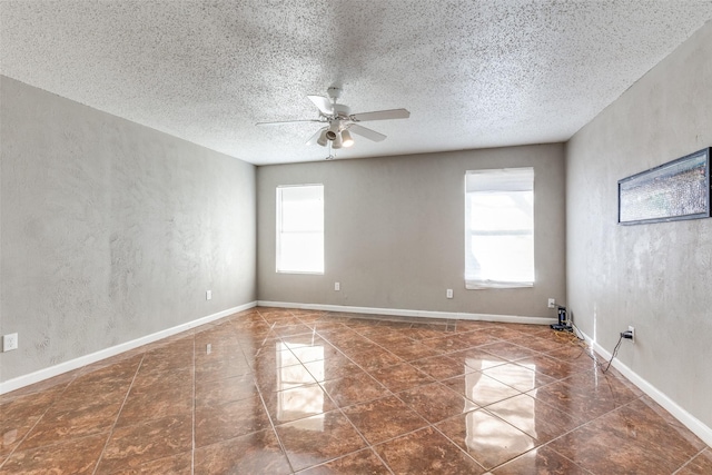 3816 Lauretta Dr, Fort Worth, TX 76119 - empty room featuring baseboards, a textured ceiling, a healthy amount of sunlight, and a ceiling fan