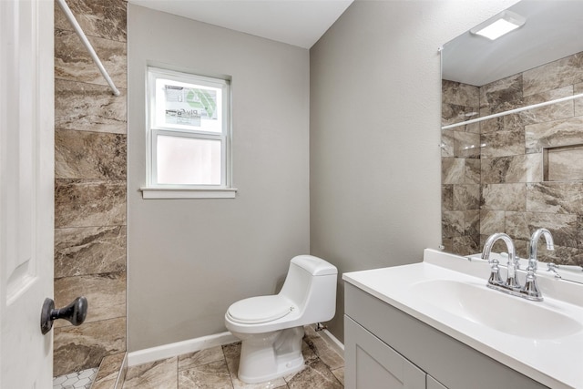 3816 Lauretta Dr, Fort Worth, TX 76119 - bathroom featuring toilet, vanity, baseboards, and a tile shower