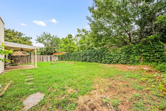 3712 Chittam Ln, Bedford, TX 76021 - fenced backyard with a ceiling fan