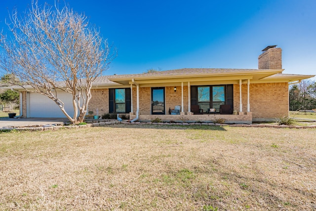 ranch-style home featuring covered porch, a chimney, brick siding, a front lawn, and a garage